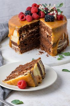 Delicious caramel cake with blackberries and raspberries.