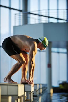 health and fitness lifestyle concept with young athlete swimmer recreating  on olimpic pool