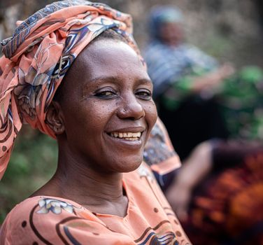 Black African senior beautiful woman with scarf outdoors