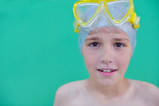 happy little child portrait on swimming school classes and recreation at indoor pool