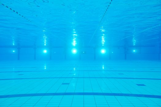 sport swimming pool  underwater with blue color and swimmers