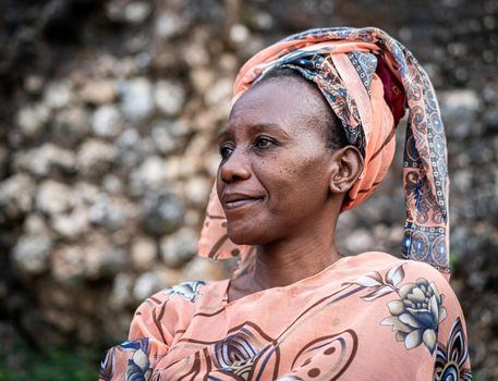 Black African senior beautiful woman with scarf outdoors