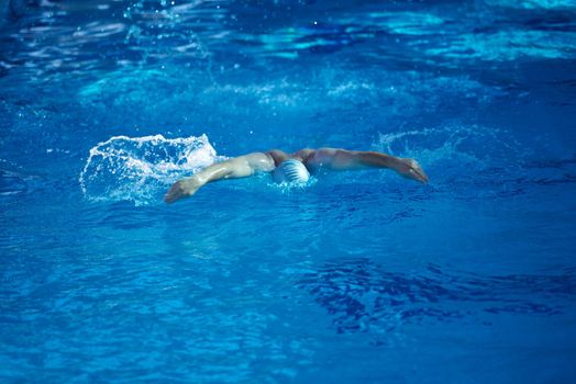 swimmer excercise on indoor swimming pool, sport and health concept