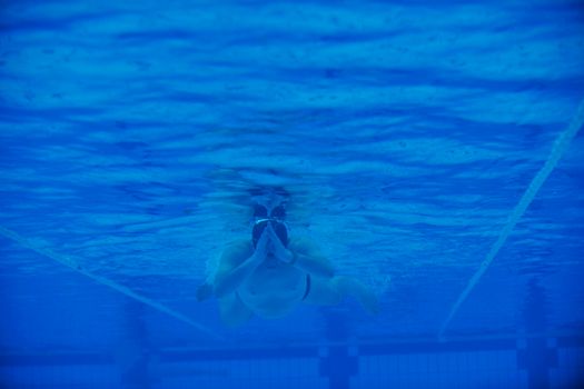 sport swimming pool  underwater with blue color and swimmers