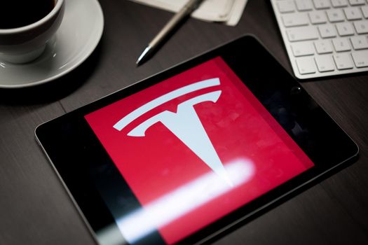 New York, New York / USA - 11 11 2019: Logo of Tesla on the iPad Air2 in on office desk