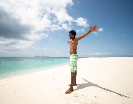 Young black African man on beautiful beach sea