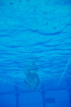 sport swimming pool  underwater with blue color and swimmers