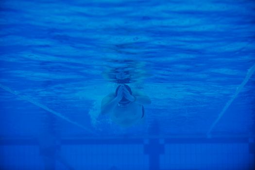 sport swimming pool  underwater with blue color and swimmers