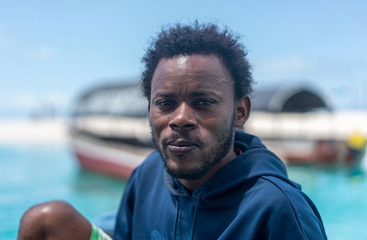 Young black man working on a coast