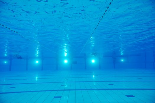 sport swimming pool  underwater with blue color and swimmers