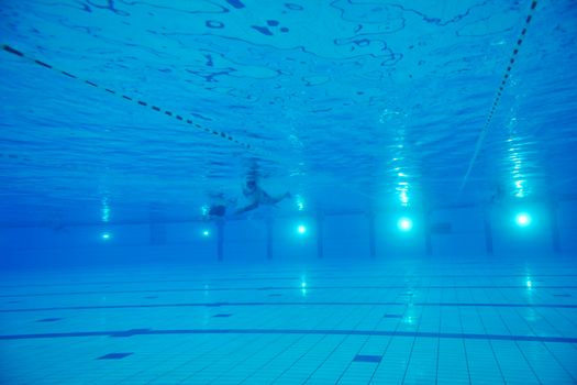 sport swimming pool  underwater with blue color and swimmers