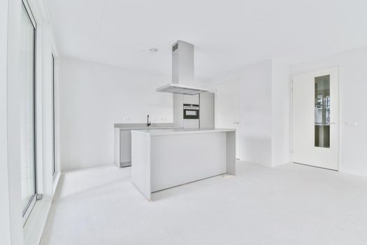 Snow-white kitchen area in a large elegant apartment