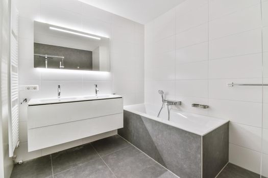 Modern and sleek bathroom with gray tiled floor