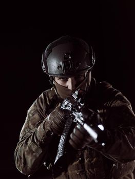 soldier with weapon and full military equioment  and combat gear in night mission