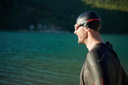 triathlon athlete start swimming training splashing water while running and jumping