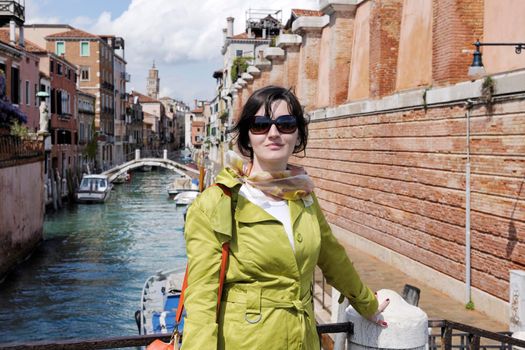 Beautiful tourist woman in Venice, exploring the old city