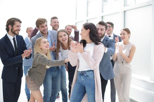 business team congratulating their leader. the concept of teamwork