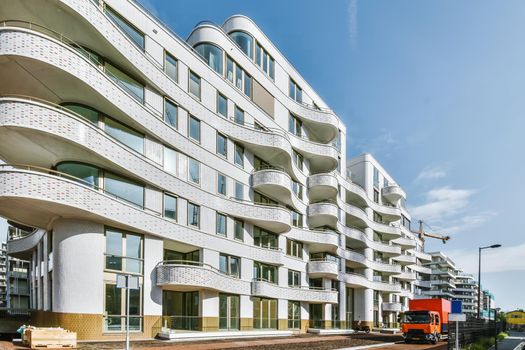 Beautiful multi-storey white building with unusual architecture