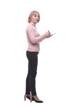 Full length portrait of smiling business woman pointing on blank clipboard isolated over white background