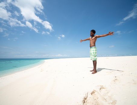 Young black African man on beautiful beach sea