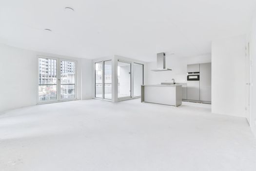 Snow-white kitchen area in a large elegant apartment