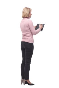 Full length portrait of smiling business woman pointing on blank clipboard isolated over white background