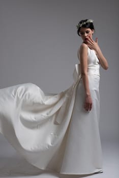 Portrait of beautiful young women in wedding dress isolated on a white background