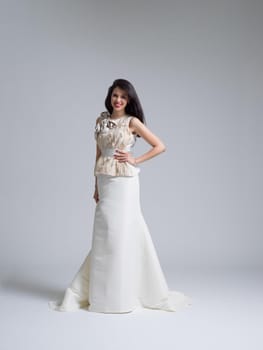 Portrait of beautiful young women in wedding dress isolated on a white background