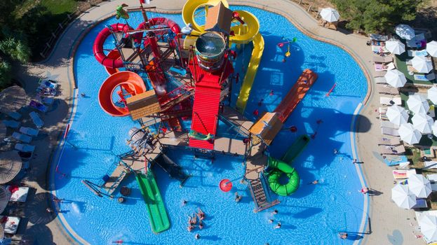 colorful water park aquapark water splash aerial top view of happy unidentified people and kids having fun and get relaxed