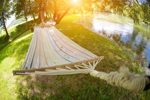 hammoc swing bed summer time in beautiful nature camp near river