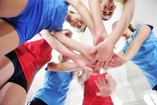 volleyball game sport with group of young beautiful  girls indoor in sport arena