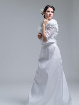 Portrait of beautiful young women in wedding dress isolated on a white background