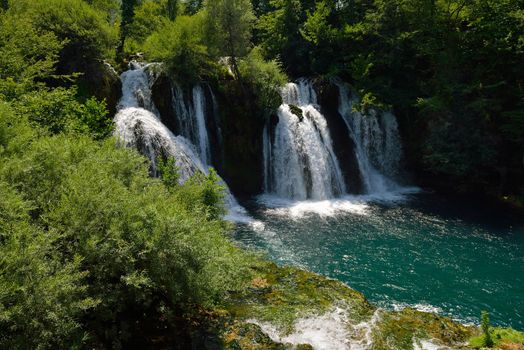 waterfall with clean and fresh water  nature with green forest in background