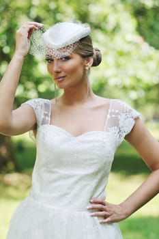 beautiful bride woman people in fashion wedding dress posing outdoor in bright park