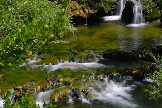 waterfall with clean and fresh water  nature with green forest in background