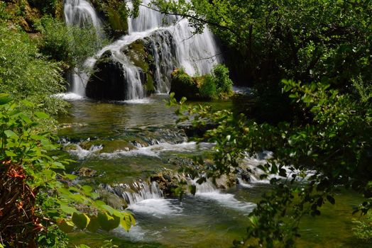 waterfall with clean and fresh water  nature with green forest in background