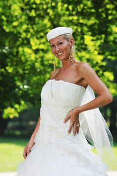 beautiful bride woman people in fashion wedding dress posing outdoor in bright park