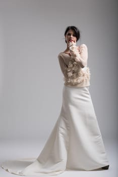 Portrait of beautiful young women in wedding dress isolated on a white background