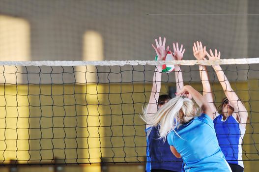 volleyball game sport with group of girls indoor in sport arena