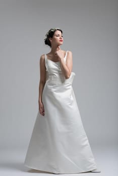 Portrait of beautiful young women in wedding dress isolated on a white background