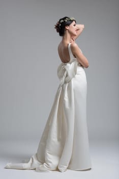 Portrait of beautiful young women in wedding dress isolated on a white background