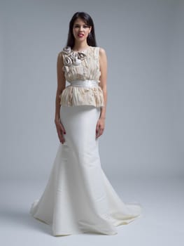 Portrait of beautiful young women in wedding dress isolated on a white background