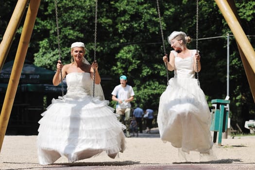 beautiful bride woman people in fashion wedding dress posing outdoor in bright park