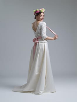 Portrait of beautiful young women in wedding dress isolated on a white background