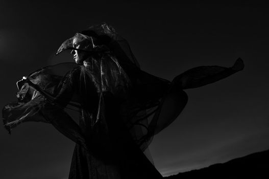 young beautiful bride in black wedding dress outdoor in night