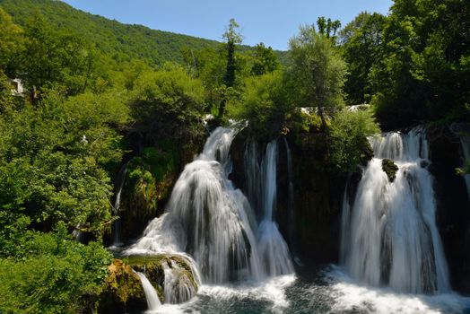 waterfall with clean and fresh water  nature with green forest in background