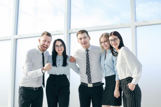 successful business team standing near the office window. photo with copy space