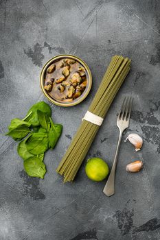 Ingredients for making pasta with seafood set, on gray stone table background, top view flat lay