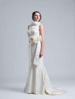 Portrait of beautiful young women in wedding dress isolated on a white background