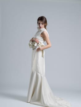 Portrait of beautiful young women in wedding dress isolated on a white background